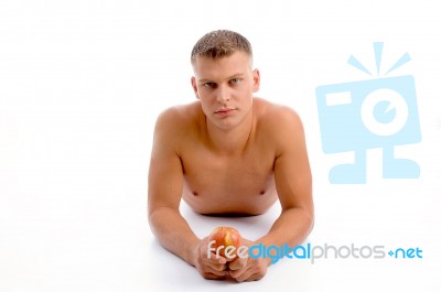 Laying Fit Man With Apple Stock Photo