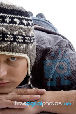 Laying Male Wearing Woollen Cap Stock Photo