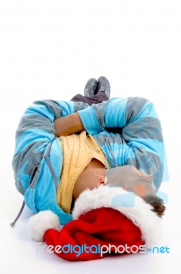 Laying Man With Christmas Hat Stock Photo