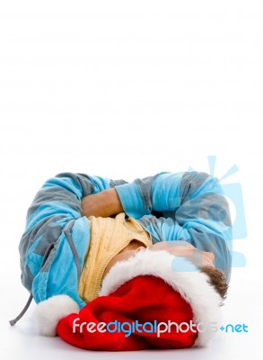 Laying Man With Christmas Hat Stock Photo