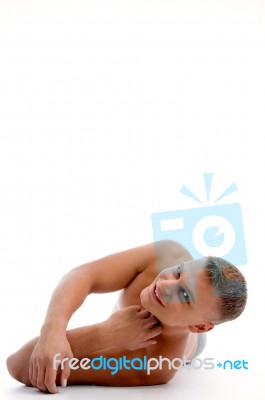 Laying Muscular Guy Looking At You Stock Photo