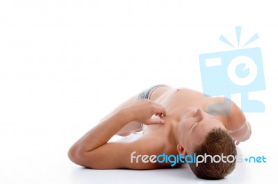 Laying Muscular Man Stock Photo