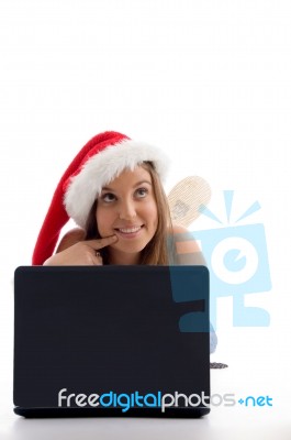 Laying Woman With Christmas Hat And Notebook Stock Photo