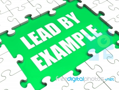 Lead By Example Puzzle Shows Leading Leadership And Motivation Stock Image