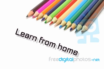 Learn From Home Text With Coloful Colored Pencil Stock Photo