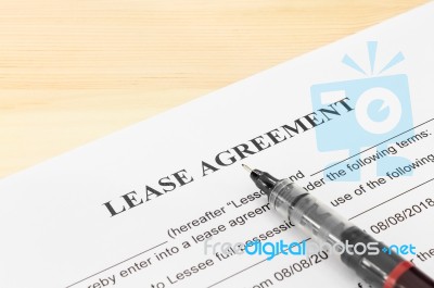 Lease Agreement Contract Document, Pen At Bottom Right Corner Stock Photo