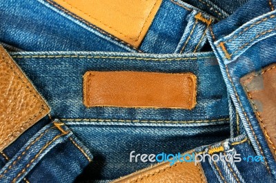 Leather Label On Jeans Background Stock Photo