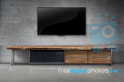 Led Tv On Concrete Wall With Wooden Furniture In Living Room Stock Photo