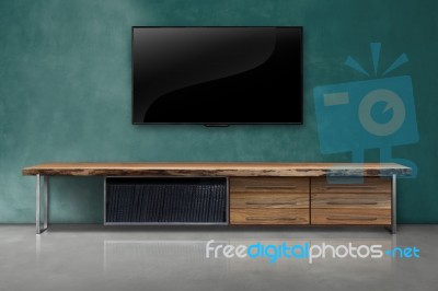 Led Tv On Concrete Wall With Wooden Furniture In Living Room Stock Photo