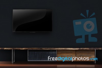 Led Tv On Concrete Wall With Wooden Furniture In Living Room Stock Photo