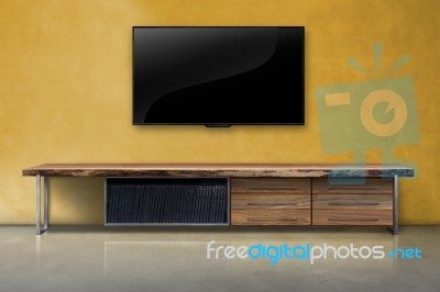 Led Tv On Concrete Wall With Wooden Furniture In Living Room Stock Photo