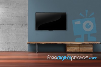 Led Tv On Concrete Wall With Wooden Furniture In Living Room Stock Photo