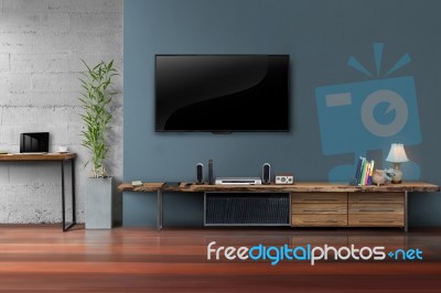 Led Tv On Concrete Wall With Wooden Furniture In Living Room Stock Photo