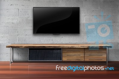 Led Tv On Concrete Wall With Wooden Furniture In Living Room Stock Photo