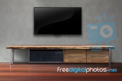 Led Tv On Concrete Wall With Wooden Furniture In Living Room Stock Photo