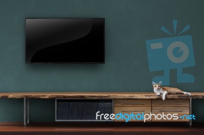 Led Tv On Concrete Wall With Wooden Furniture In Living Room Stock Photo