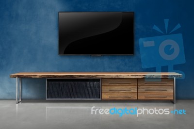 Led Tv On Concrete Wall With Wooden Furniture In Living Room Stock Photo