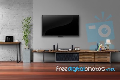 Led Tv On Concrete Wall With Wooden Furniture In Living Room Stock Photo