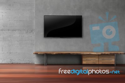 Led Tv On Concrete Wall With Wooden Furniture In Living Room Stock Photo