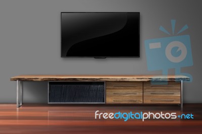 Led Tv On Concrete Wall With Wooden Furniture In Living Room Stock Photo