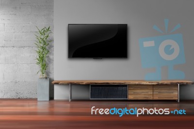 Led Tv On Concrete Wall With Wooden Furniture In Living Room Stock Photo