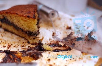 Leftover Cake With Chocolate Cream And Crumbs Stock Photo