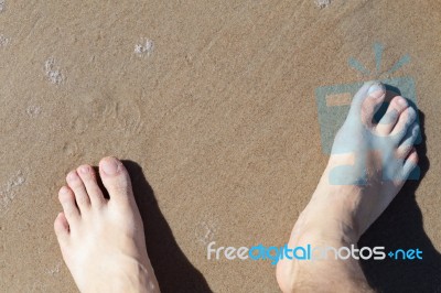 Leg On Sea Sand Stock Photo