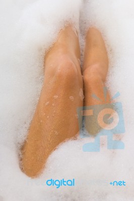 Legs Of Female In The Bathtub Stock Photo