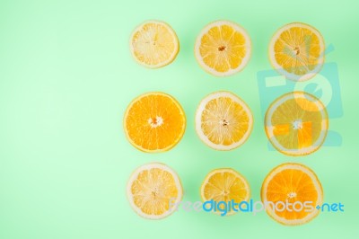 Lemon And Orange Slices On The  Light Blue Background Top View Stock Photo