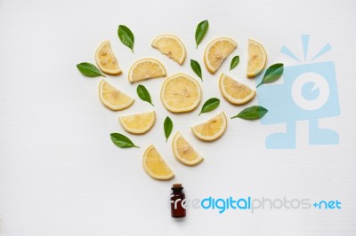 Lemon Essential Oil With Fresh Lemon And Leaf Stock Photo