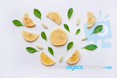 Lemon, Leaves And Vitamin C. On White Stock Photo