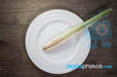 Lemongrass In Ceramic Dish On Wood Background Stock Photo