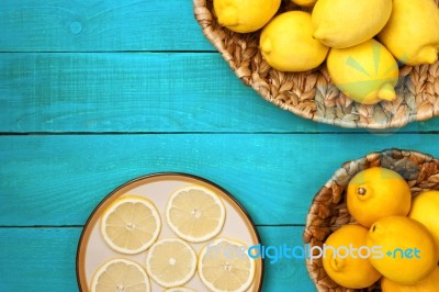 Lemons On The Bright Cyan Background Stock Photo