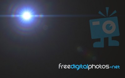 Lens Flare Light Over Black Background. Easy To Add Overlay Or S… Stock Image