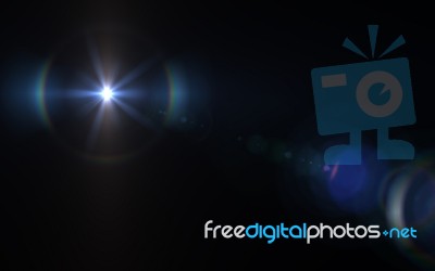 Lens Flare Light Over Black Background. Easy To Add Overlay Or S… Stock Image