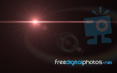 Lens Flare Shot In Studio Over Black Background. Easy To Add As Overlay Or Screen Filter Over Photos Stock Image