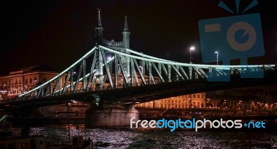 Liberty Bridge Illuminated At Night In Budapest Stock Photo