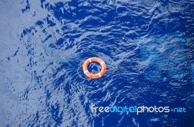 Life Buoy Bound With Rope Rescue Floating In The Sea Stock Photo