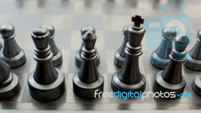 Light And Dark Wooden Chess Pieces On Chess Table Stock Photo