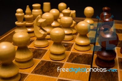 Light And Dark Wooden Chess Pieces On Chess Table Stock Photo