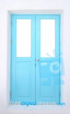 Light Blue Wooden Door With Cement Wall Stock Photo