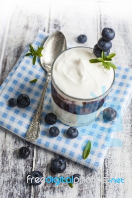 Light Breakfast Setup With Yogurt On White Wooden Table Stock Photo