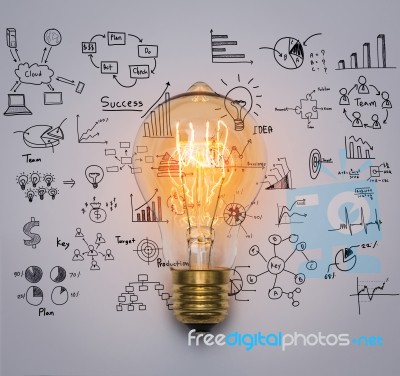 Light Bulb With Drawing Graph Stock Photo