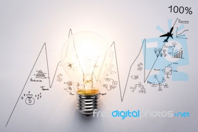 Light Bulb With Drawing Graph Stock Photo