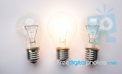 Light Bulb With Drawing Graph Stock Photo