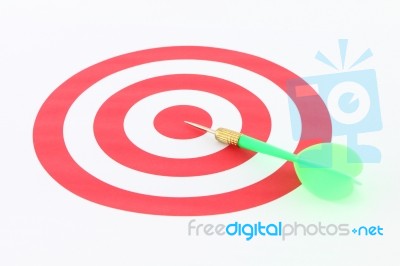 Light Green Dart On Center Of Target Stock Photo