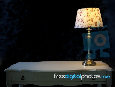 Light Lamp On White Table Stock Photo