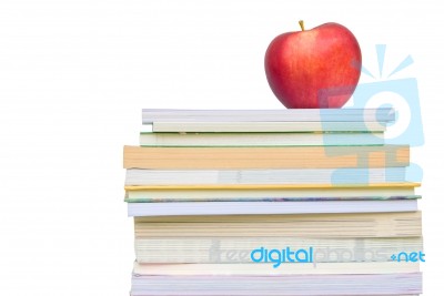 Light Red Apple On Book Stack Stock Photo