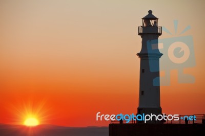 Lighthouse At Sunset Stock Photo