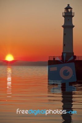 Lighthouse At Sunset Stock Photo